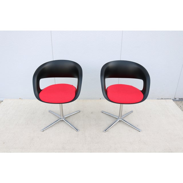 Fabulous pair of Lox swivel chairs designed by Pearson Lloyd for Coalesse. The Lox chair blends style with support through...
