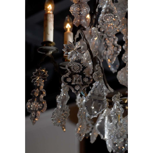 A French Baroque Revival crystal six-light chandelier from the mid 19th century, with black patinated bronze armature,...