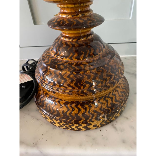 Beautiful ceramic hand painted and hand glazed table lamp from British designer Penny Morrison. Amber and brown colored in...