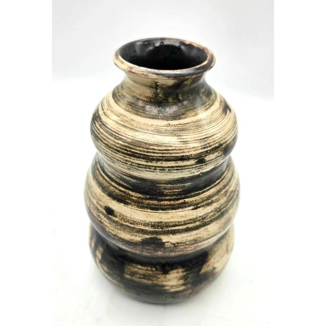 Offered is a vintage mid 20th Century wheel-thrown multi-tiered or "hooped" ceramic bud vase with a stacked bulbous shape...