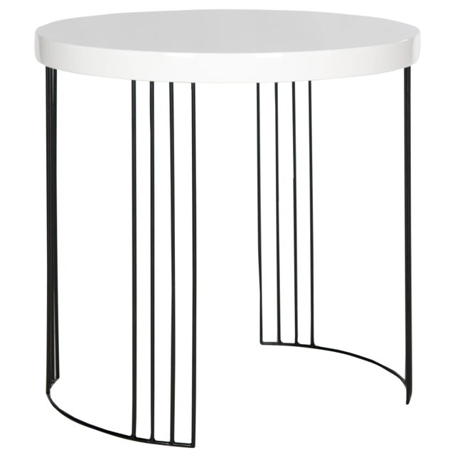 A nod to plane geometry, the round lacquer side table creates a crisp contemporary statement beside a sofa or chair. This...