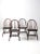 This set of four antique wooden dining chairs is crafted in the classic Windsor style, celebrated for its timeless...