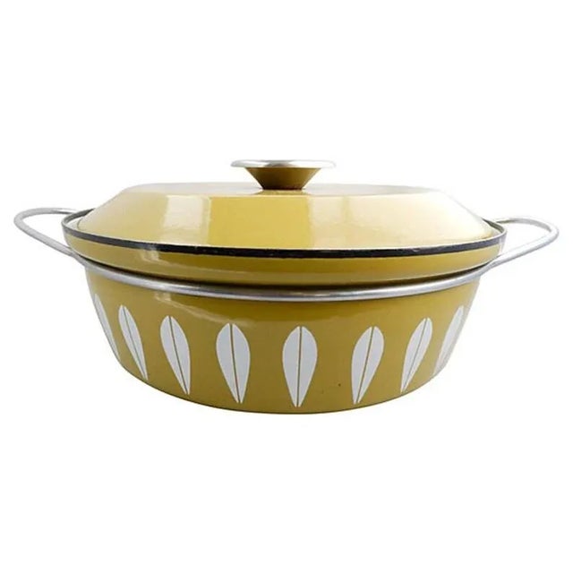 Covered green-and-white enameled cooking pot with lid in "lettuce" design. Maker's mark reads "Cathrine Holm Norway."...