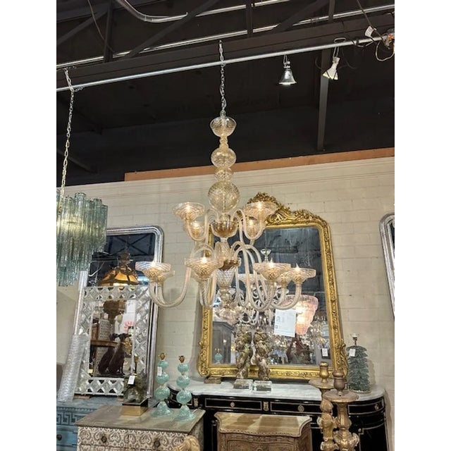 Exceptional large scale two-tiered gold "quilt glass" Murano chandelier. Featuring beautiful draping arms on a ball form...