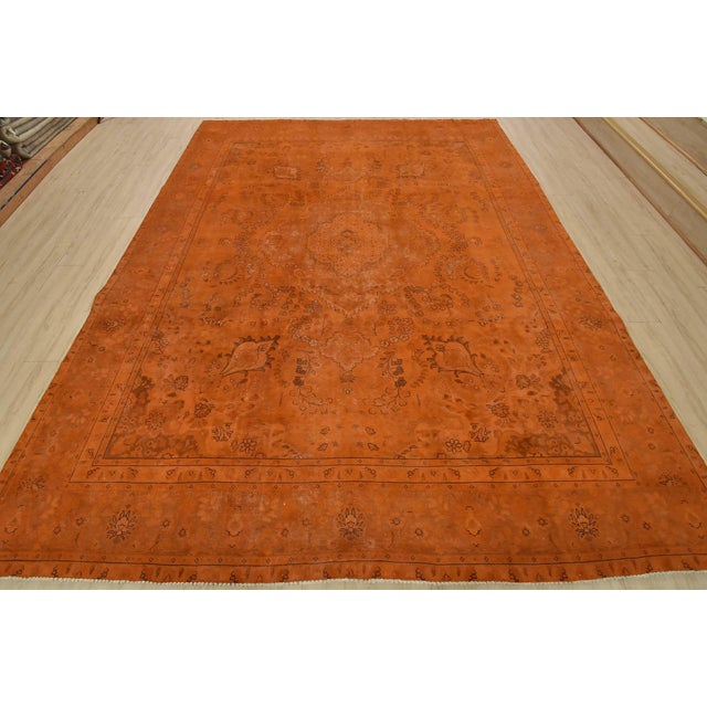 An authentic vintage traditional Overdyed Tabriz rug hand-knotted with an all-wool pile on a cotton foundation. This...