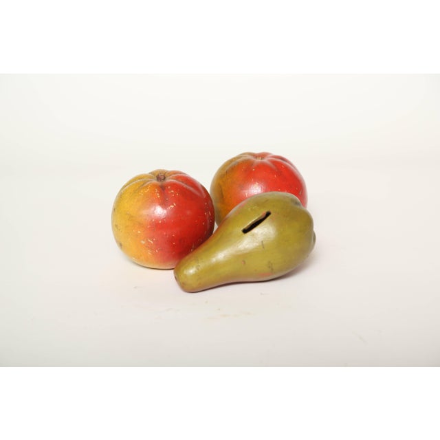 English antique pear and apple red ware pottery fruit. The pear was slotted to be a child's bank, while the two apples...
