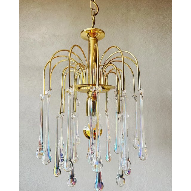 Beautiful luxury chandelier. with its romantic glass 'teardrops' really a feast for the eyes. Period: 1970s. Features a...
