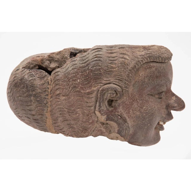 A figurative construction ceramic probably a water collector simply modeled, this head is very expressive and the details...