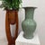 "About This Piece About This Piece A timeless fusion of serenity and craftsmanship, this tall green porcelain vase...