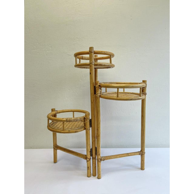 Elegant Folding Bamboo 3 plant stand 3 tier, made of wood, bamboo and rattan. Made in the 70s - 80s, very cute and...