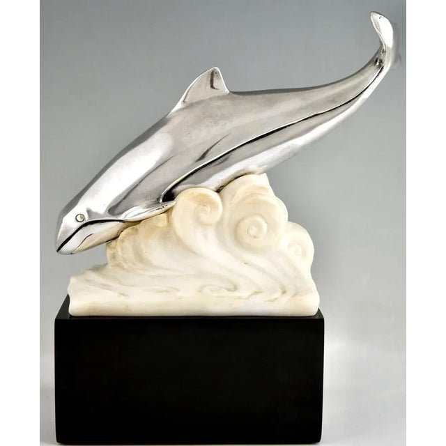 Art Deco bronze sculpture whale in the waves by Marcel André Bouraine Bronze with silver patine, alabaster waves, on a...