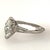 Vintage platinum ring with 0.89 carat GIA certified I color VS1 clarity marquis cut diamond and 2 baguette diamonds...