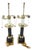 A pair of neoclassical column table lamps in polished brass and black marble, unbranded. Each lamp rises from a stepped...