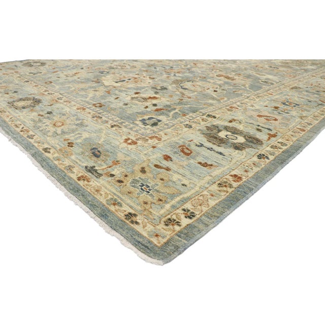 60899 Persian Sultanabad Rug 10'02 x 14'05. This hand-knotted wool Persian Sultanabad rug features an all-over botanical...