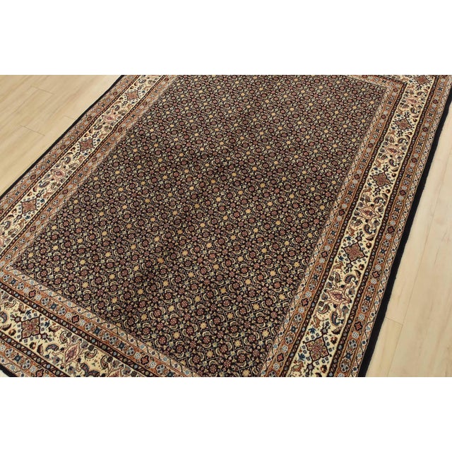 An authentic vintage traditional Mood rug, hand-knotted with fine wool and silk highlights, using natural dyes. This...