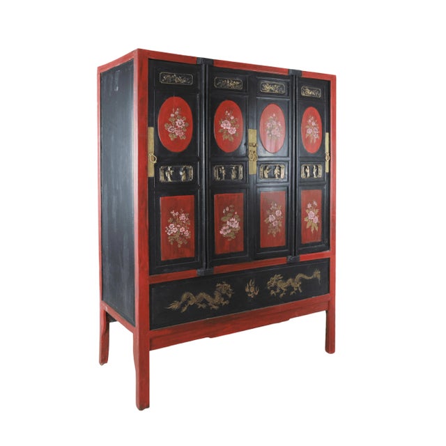Painted and carved antique style Chinese cabinets.Features hand-carved and hand-painted floral panels.The cabinet doors...