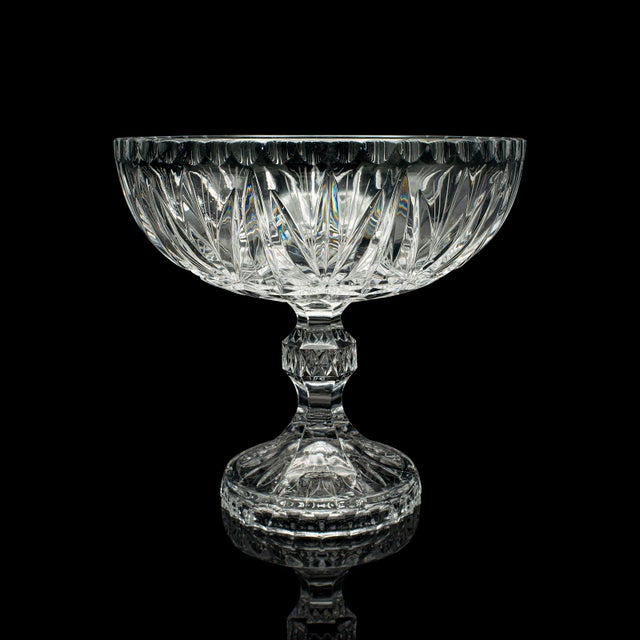 This is a vintage crystal footed grape bowl. An English, cut crystal glass decorative comport, dating to the mid 20th...