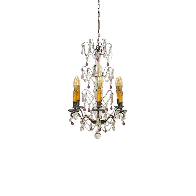 Belle Époque chandelier from the early 20th century, with a frame of blown glass and metal, adorned with handmade clear,...