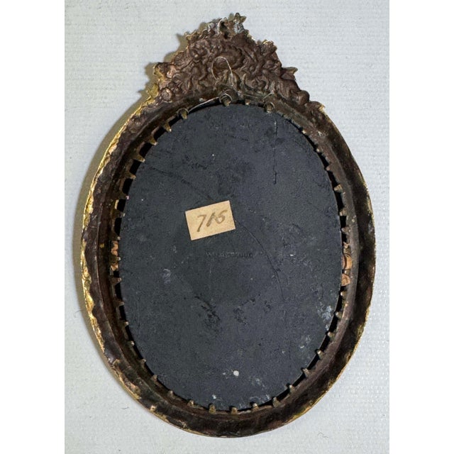 Antique 18th century Wedgwood jasperware rosso antico oval plaque. The black neoclassical figure is in high relief against...