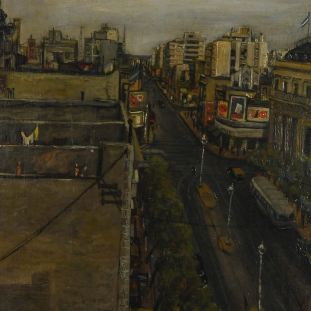 This Framed Signed Giovanni Columbo (1908-1972) Bustling Cityscape captures a dynamic urban scene from an elevated vantage...