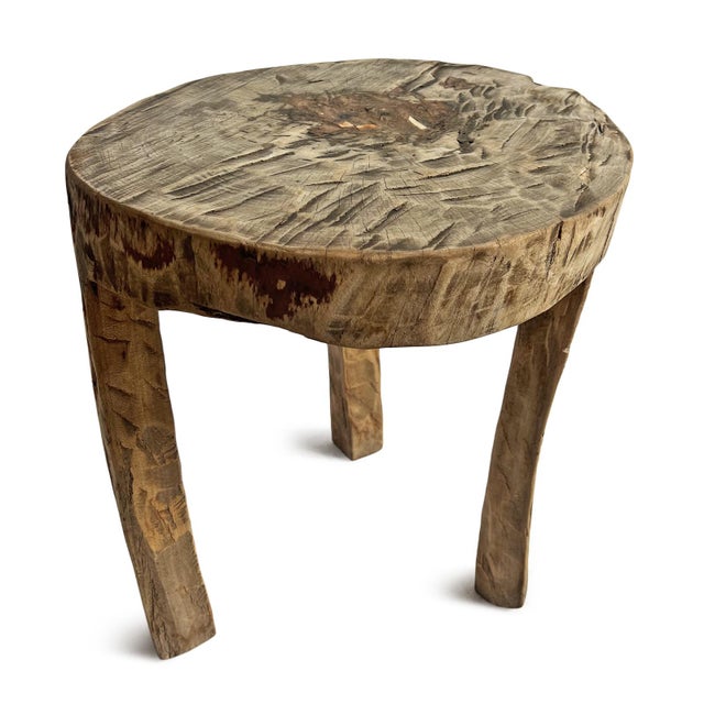 Rustic and beautiful hand ax chiseled raw wood table created from a solid hard wood trunk. Naga tribal indigenous accent...