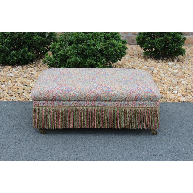 The colors in the upholstery fabric and the bouillon trim remind me of a candy shop with lovely pastel shades everywhere....