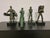 Group of 4 bronzes depicting glass processing. Four bronze sculptures depicting the various stages of glass processing....