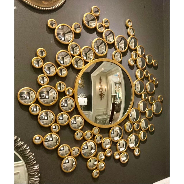 Original retail $2400, stylish global Views Modern Gold Aquarius Wall Mirror, showroom floor sample