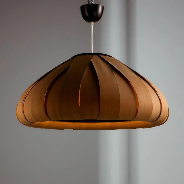 Hungarian pendant from the 1980s, made and produced by the IDEA Applied Arts Company. The lamp is made of veneer slices...