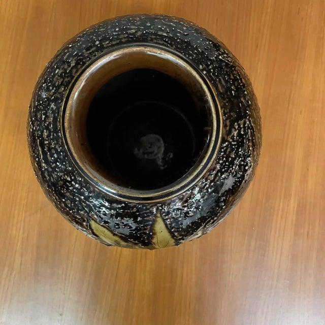 A stunning mid-century Japanese studio pottery vase featuring an almost black glaze accented with shimmering copper specks...