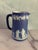 Lovely and graceful blue and white Jasperware pitcher from Wedgwood. Made in England. Decorated with familial figures,...