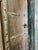 A striking antique architectural arch doorway crafted from solid teak, featuring hand-carved columns on either side and a...