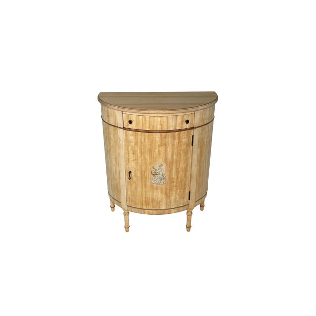 This sweet little demilune cabinet used to be painted. Unfortunately, the paint did not fair nearly as well as the cabinet...