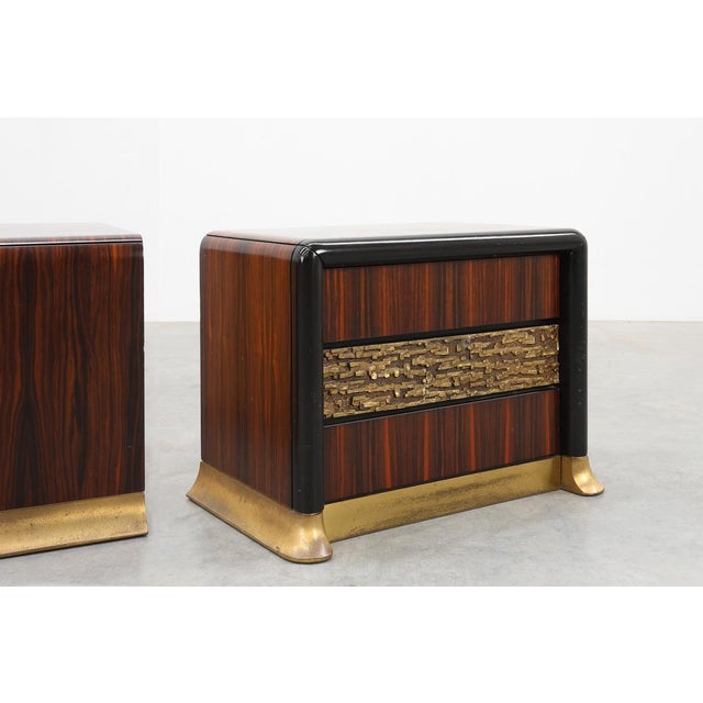 Dating back to the 1970s, this rare and exceptionally striking pair of Italian nightstands perfectly captures the...