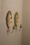 Made in Sweden. Two exquisite leaf shape brass candle sconces from the Mid Century era, meticulously handcrafted with a...