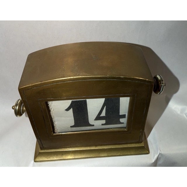 This listing is for an antique Austrian perpetual desk calendar. The knobs on the sides can be turned to adjust the...
