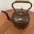This large antique Victorian copper kettle is a unique piece with a beautiful brass and silver patchwork design on its...