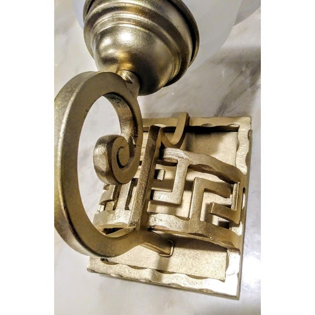 A Pair Iron Greek Key Gold Metallic And Frosted Glass Wall Sconces