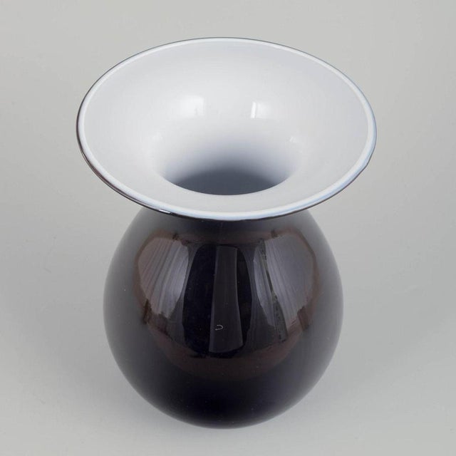 Peter svarrer for holmegaard vase “shape”. Early 21st c. Elegant hand-blown vase in black and white glass from the shape...