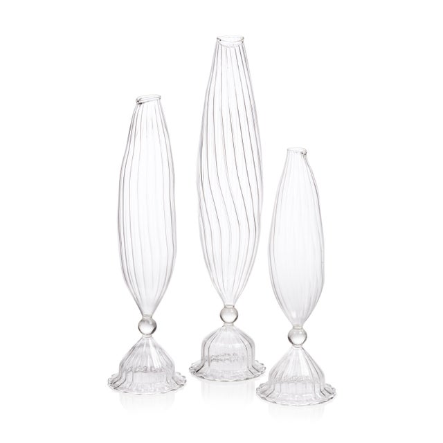 The Flo 2-Piece Set Optic Glass Vases are beautifully crafted to mimic the graceful curves and shape of corn, with a...