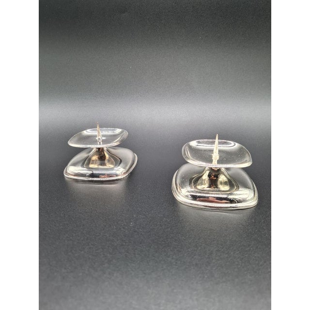 An elegant pair of mid-century modern table candle holders, manufactured by the renowned german manufacturer wmf. Their...