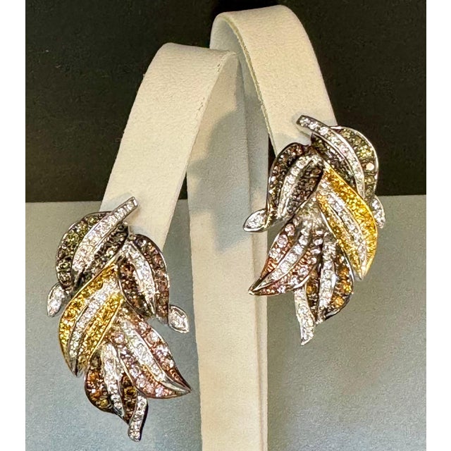 4 Ct Natural Fancy Color Diamond Flower Earrings in 18 Kt Multi Color Gold These exquisite earrings feature approximately...
