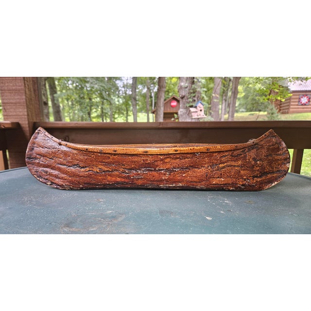 This vintage handcrafted Birch bark model canoe is 20" long handcrafted from natural Birch bark. This piece makes a...