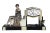 An exceptional and difficult to find Art Deco Garniture Clock Set depicting a young lady looking down at birds below. Set...