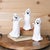 Add a ghostly glow to your Halloween decor with this set of 3 Spooky Ghost Figurines! Each ghost features a unique,...