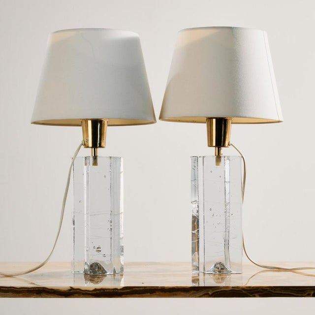 A pair of ‘Arkipelago’ table lamps designed by Timo Sarpaneva for Fagerhults from the 1970s. Thanks to its design and...