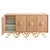 Commanding scale and simple form with turned oak handles and luxe velvet-lined drawers resting on a sinuous brushed brass...