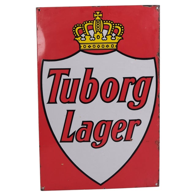 Original enamel advertising sign for Tuborg Lager featuring the classic red and white design with the distinctive royal...