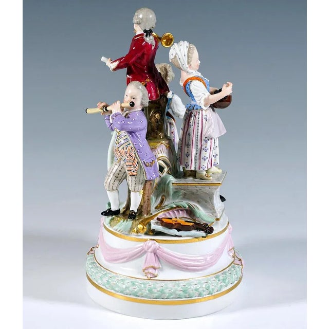 Excellent meissen piece from the time the model was created: four children in festive rural rococo dress on a high,...