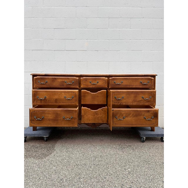 I have a beautiful Ethan Allen Traditional 9-Drawer Dresser made in America – GOOD condition! This piece has a warm wood...